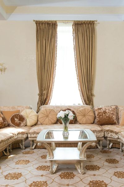 Sunlight streaming through a large window onto an empty floor.